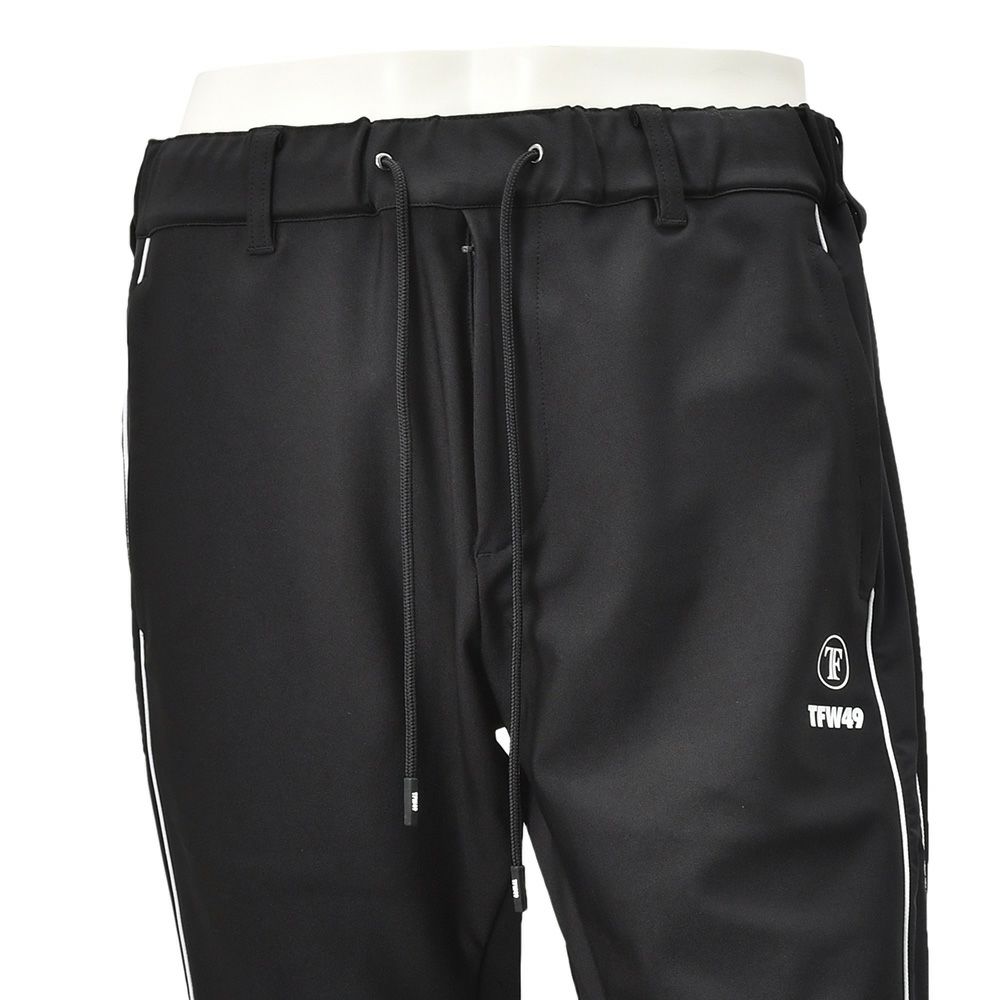TFW49ティーエフダブリューフォーティーナイントラックパンツメンズジャージーパンツブラック黒配色パターン異素材切り替え2WAYキックバックUVカット吸水速乾多機能国内正規品でらでら公式ブランド