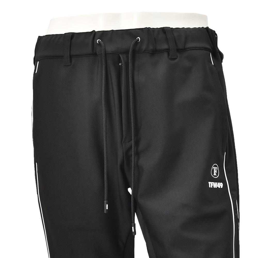 TFW49ティーエフダブリューフォーティーナイントラックパンツメンズジャージーパンツブラック黒配色パターン異素材切り替え2WAYキックバックUVカット吸水速乾多機能国内正規品でらでら公式ブランド